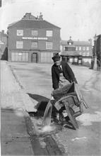 Bruff Hewitt flushing the surface drains in the North Walsham Market Place