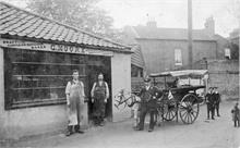 Jack Hall with pony cart outside G Moore bootmaker shop in Mundesley Road.