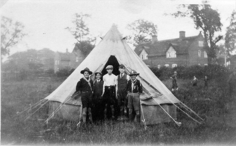 Photograph. 2nd North Walsham Scout Troop's tent pitching team off Aylsham Road (Farman's Cottages in background) (North Walsham Archive).