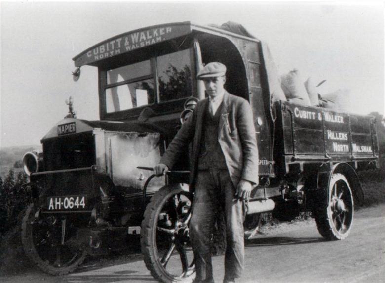 Photograph. Cubitt & Walker's Napier Lorry, bodywork built by Frank Mann, Vicarage Street. Driver is John Martin Sandall (North Walsham Archive).