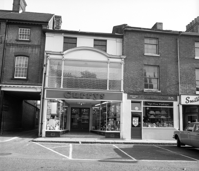 Photograph. Currys in the Market Place (North Walsham Archive).