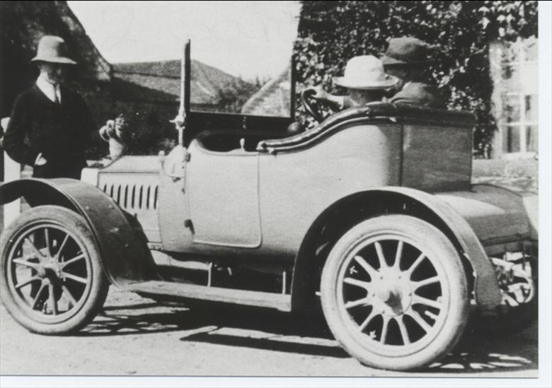 Photograph. Dr W.F.Blewitt driving his car. (North Walsham Archive).