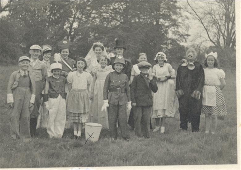 Photograph. Fancy Dress Parade at the end of the War. (North Walsham Archive).