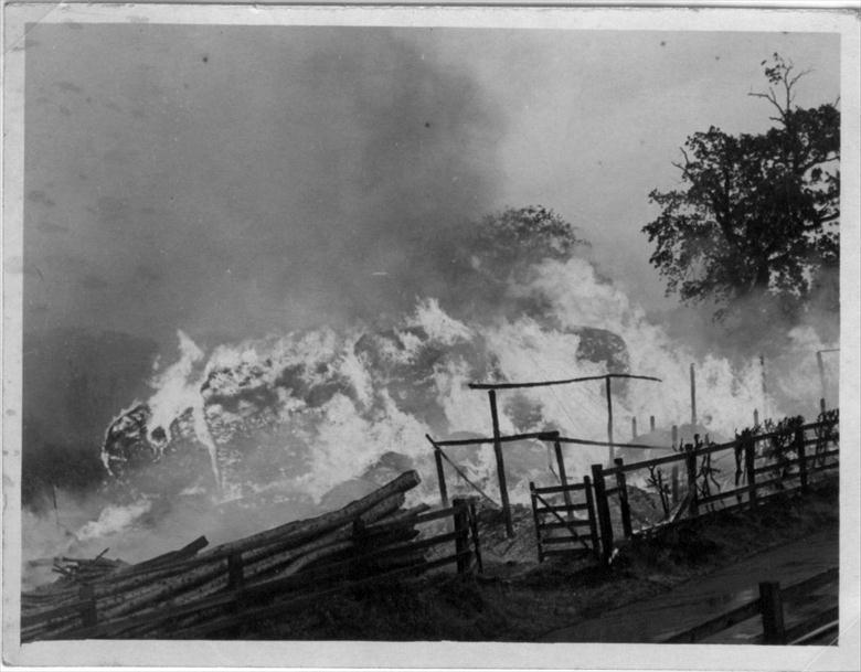 Photograph. Fire at Farman's stack yard of reeds in Park Lane, North Walsham near the Aylsham Road junction.(see scouts in 1927). (North Walsham Archive).