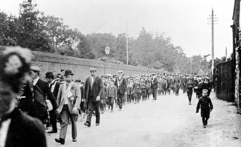 Photograph. Friendly Societies' parade along Yarmouth Road, North Walsham. (North Walsham Archive).