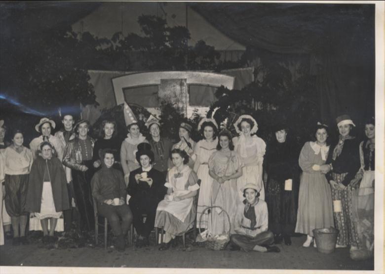 Photograph. G.F.S. North Walsham at a Pantomime Fair which they organised in aid of the Church heating fund. (North Walsham Archive).