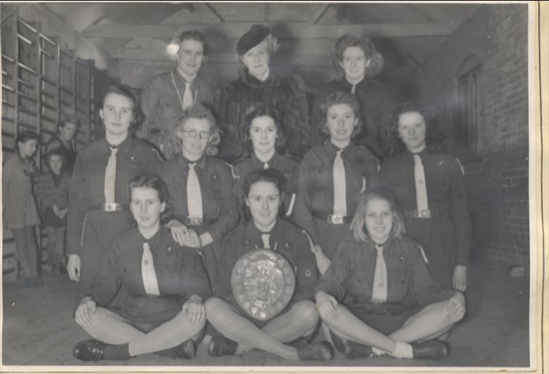 Photograph. Girl Guide Company, North Walsham,1946. Frances Green holds the shield. (North Walsham Archive).