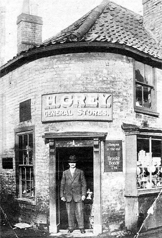 Photograph. H. Grey's general stores on the corner of Bacton Road and Back Street (North Walsham Archive).