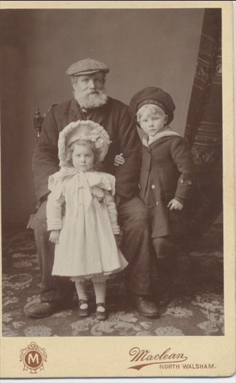 Photograph. James Dixon with grandchildren. (North Walsham Archive).