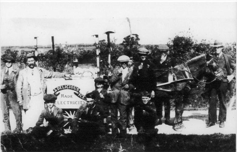 Photograph. John (Joe) White's Ice Cream cart doing a roaring trade near North Walsham. Joe is 2nd left in the picture. (North Walsham Archive).