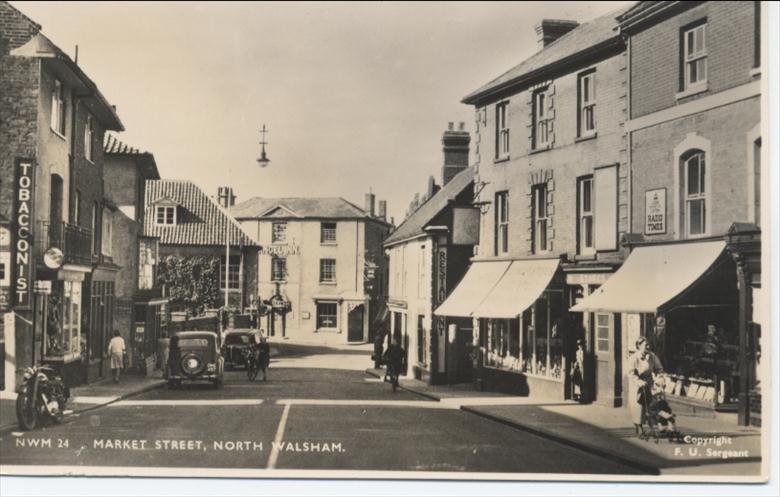 Photograph. Market Street North Walsham, about 1950. (North Walsham Archive).
