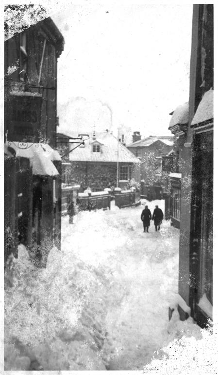 Photograph. Market Street in snow, winter of 1947. (North Walsham Archive).