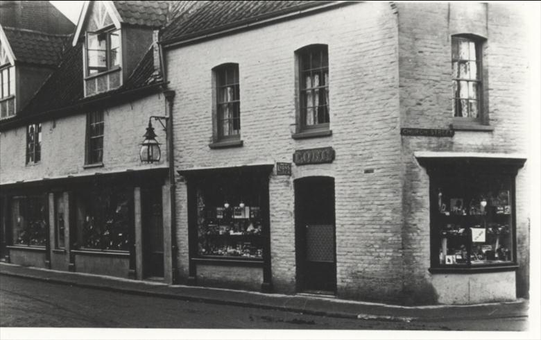 Photograph. Miss Long's shop, corner Church Street and Market Place. (North Walsham Archive).