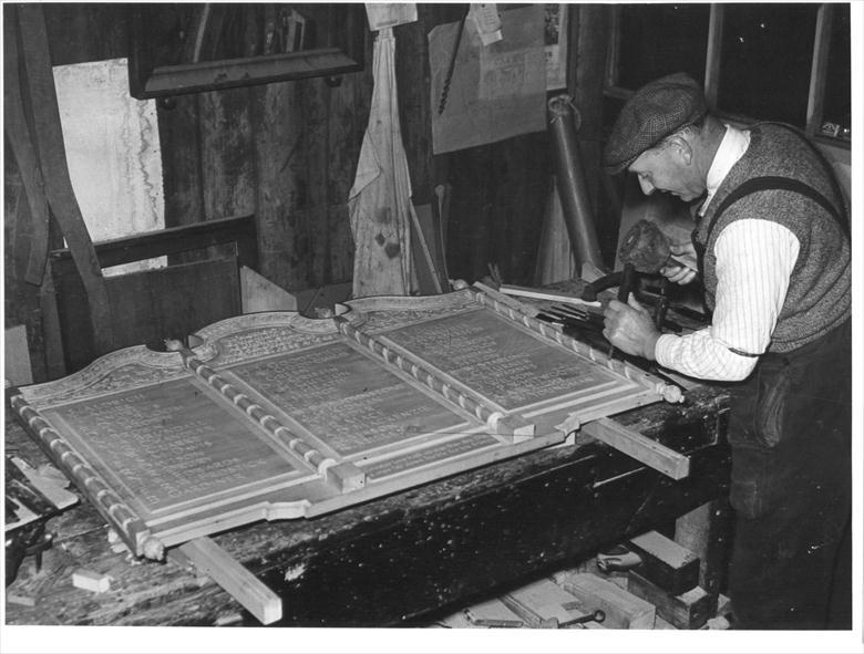 Photograph. Mr L.W.Roper, Craftsman, at work on the World War Two Memorial (North Walsham Archive).