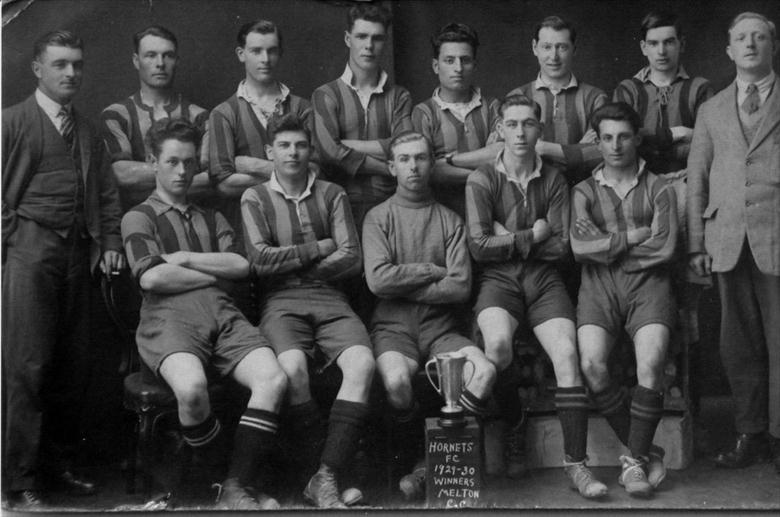 Photograph. North Walsham Hornets football team, 1929-30 season, winners of the Melton Challenge Cup. Alma Hicks top left. (North Walsham Archive).