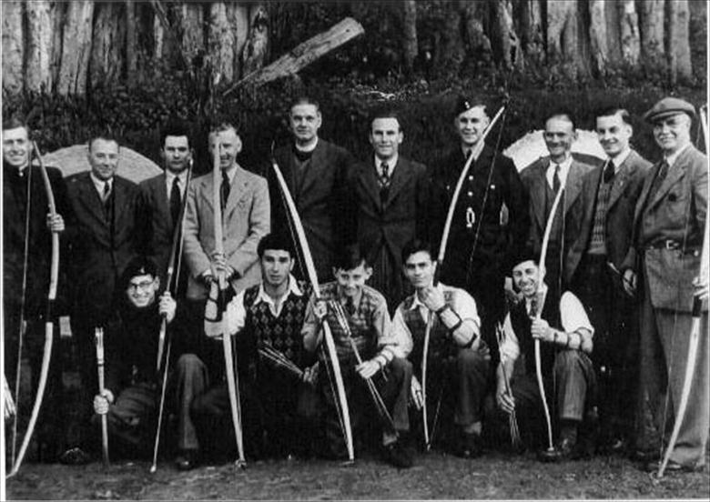 Photograph. North Walsham Rifle & Archery Club at their range on Happisburgh Road, North Walsham. Secretary, Mr J.R.Brooks on the far right (North Walsham Archive).