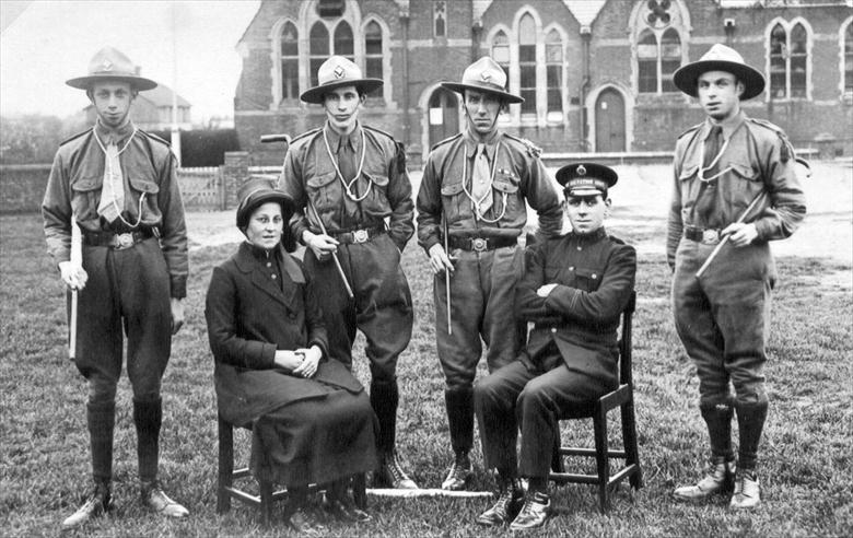 Photograph. North Walsham's Salvation Army Scout Troop on the Peoples Park. Board School, Manor Road in background. (North Walsham Archive).