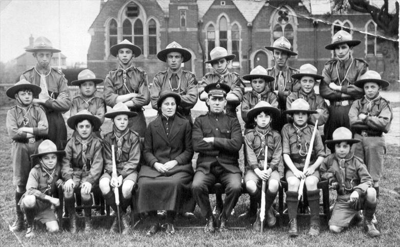 Photograph. North Walsham's Salvation Army Scouts on People's Park, Board School, Manor Road in background. (North Walsham Archive).