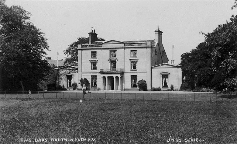 Photograph. The Oaks, North Walsham. Probably Mrs Wilkinson with dog. Demolished in the 1930s (North Walsham Archive).
