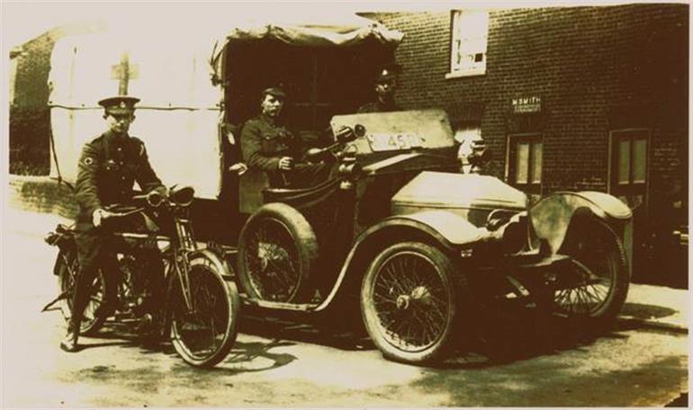 Photograph. Old ambulance on New Road, North Walsham. (North Walsham Archive).