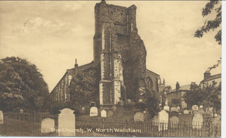 Photograph. Parish Church yard, North Walsham, note tombstones and railings still in situ. (North Walsham Archive).