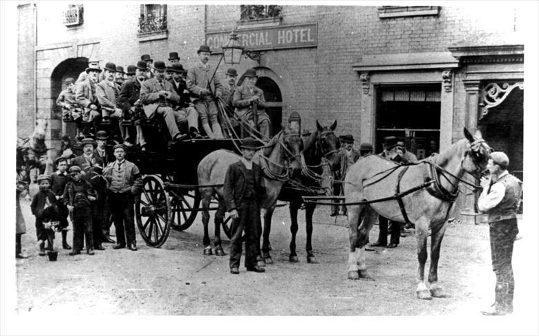 Photograph. A party of people ready to set off on a Horse Bus, pictured outside the Angel Commercial Hotel, Aylsham Road, NorthWalsham. (North Walsham Archive).