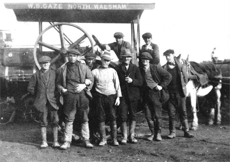 Photograph. Road gang with one of W.B.("Boyer) Gaze's steam rollers.Gaze had some 6 steam rollers and his works were what is now Antingham Drive, off Bacton Road. (North Walsham Archive).