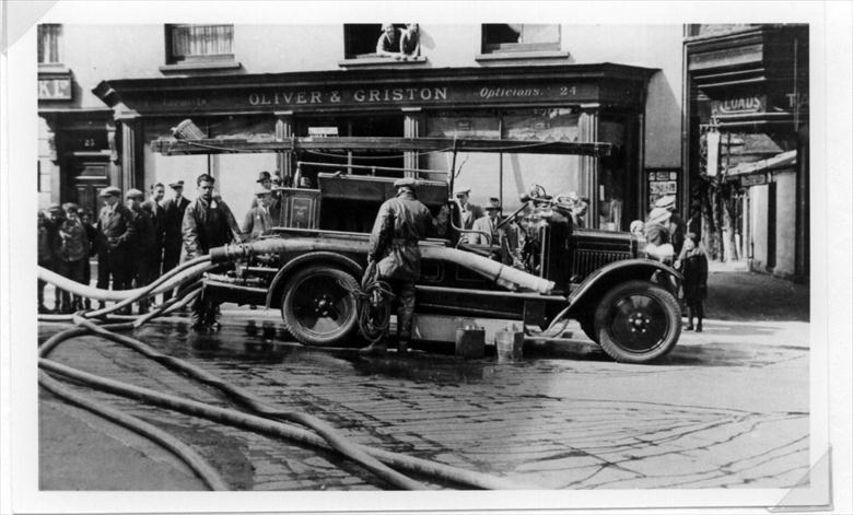Photograph. Second Motorised Fire Engine in Market Place, North Walsham - Butchery fire (North Walsham Archive).