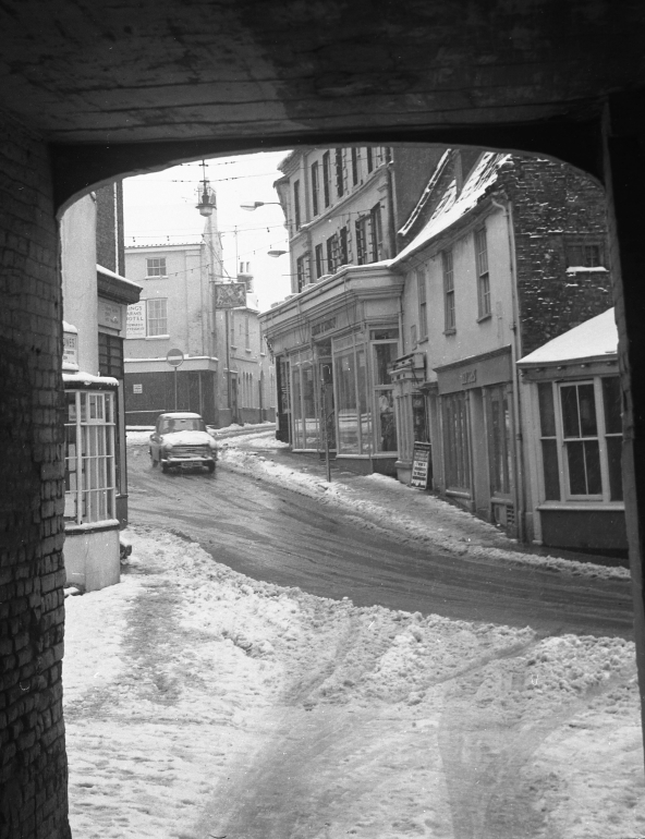 Photograph. Snow on Market Street from Mitre Tavern Arch (North Walsham Archive).