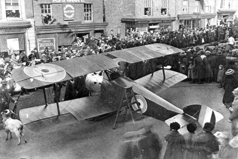 Photograph. Sopwith Camel in North Walsham Market Place. Promotion of War Bonds sales (North Walsham Archive).
