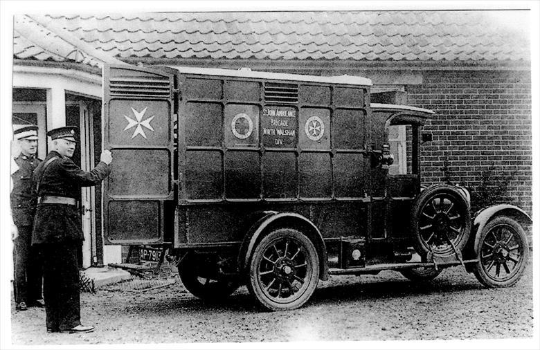St John's First motorised Ambulance - outside the North Walsham Cottage Hospital. (North Walsham Archive) Photograph. St John's First motorised Ambulance - outside the North Walsham Cottage Hospital. (North Walsham Archive).