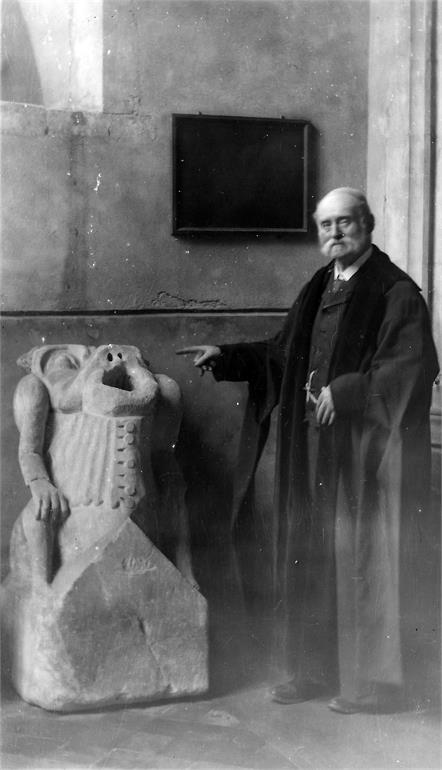 Photograph. St Nicholas Church gargoyle and Mr Teddy Dix - Sexton (North Walsham Archive).