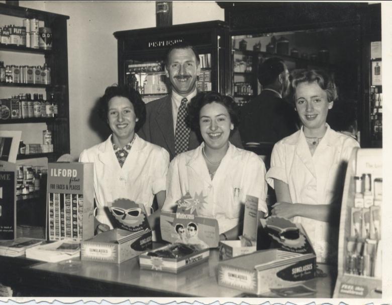 Photograph. Staff of Ling's Chemist Shop 1957. (North Walsham Archive).