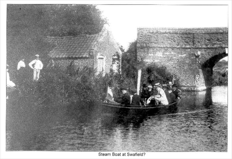 Photograph. Steam Boat at Swafield Bridge on the North Walsham-Dilham Canal.. Ling collection (North Walsham Archive).