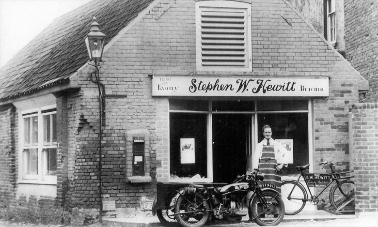 Photograph. Stephen Hewitt, Butcher, outside his new shop, Mundesley Road, North Walsham. (North Walsham Archive).
