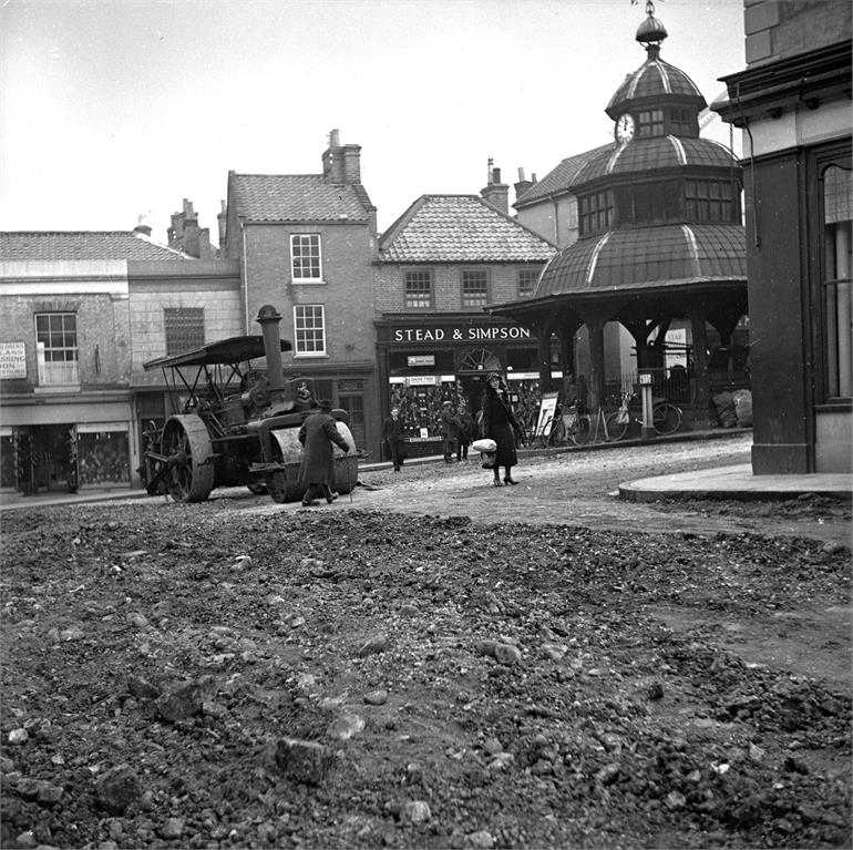 Photograph. Surfacing the Market Place, North Walsham. (North Walsham Archive).