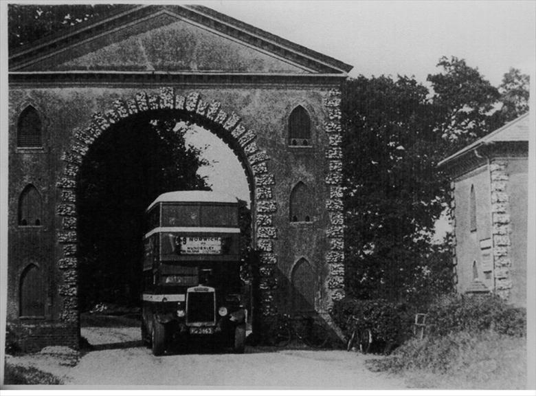 Photograph. Westwick arch with Leyland TD1 motorbus (North Walsham Archive).